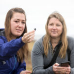 Company founders Katherine Shayne, left, and Jenna Jambeck collect litter debris near a beach. (Photo by Dorothy Kozlowski/UGA)