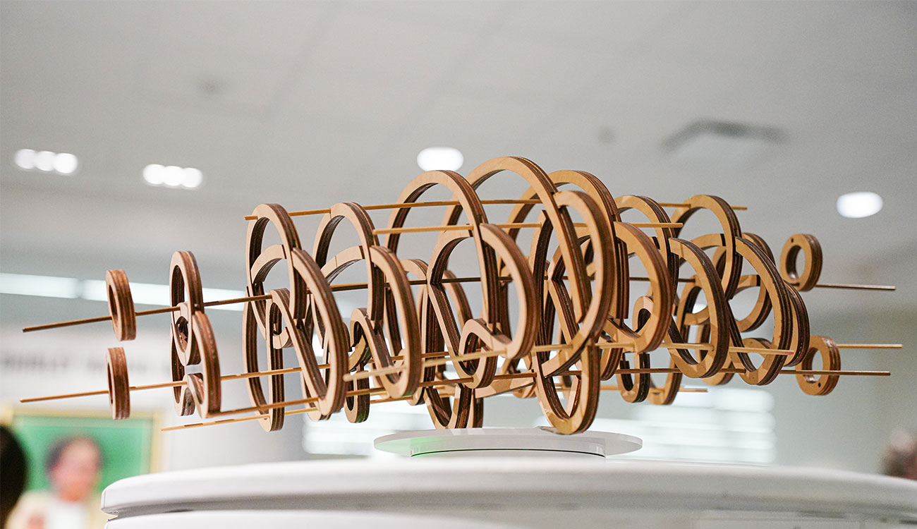 Wood spun knot sculpture by graphic design students on display in Spacing Out at the UGA McBay Science Library. Photo courtesy of Sidney Chansamone.