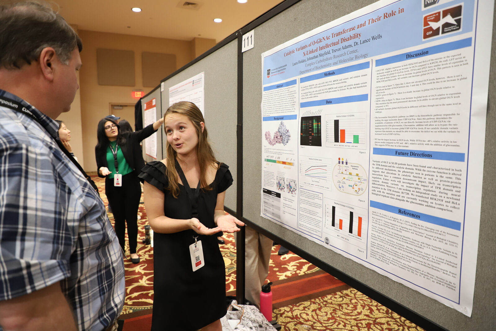curio Laura Kate Holden, center, a fourth-year CURO Honors Scholar studying biochemistry and molecular biology, will introduce the keynote speaker and her faculty mentor, Lance Wells, and present her research during the poster session. (Photo by Stephanie Schupska)
