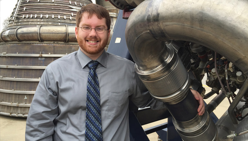 Stephen Higgins will help NASA determine if expansion joints, the corrugated fittings near his hand, can withstand the rigors of the next generation of space flight.