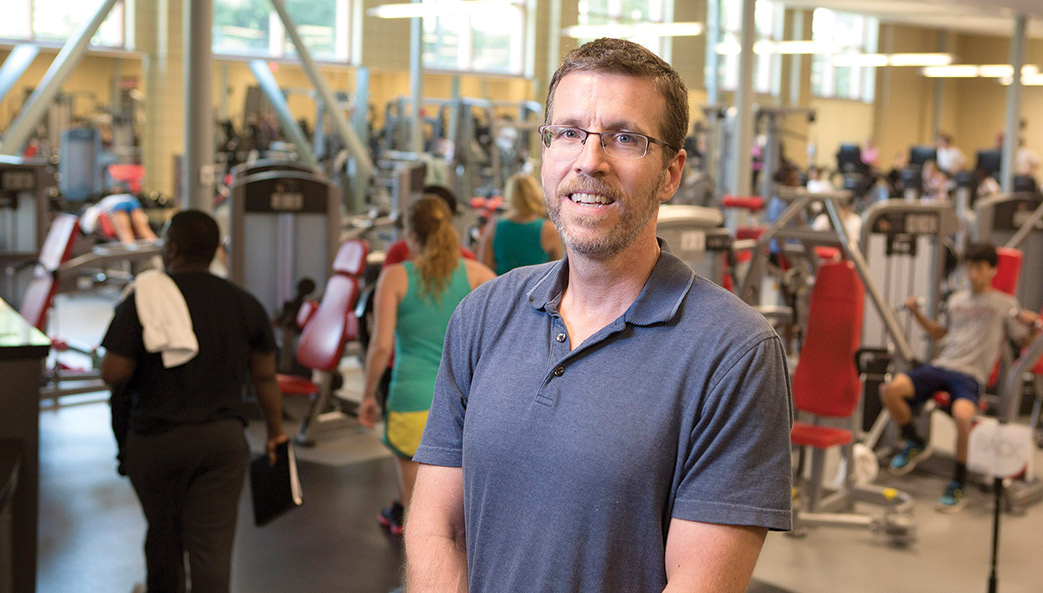 Kinesiology professor Michael Schmidt photographed in a gym.