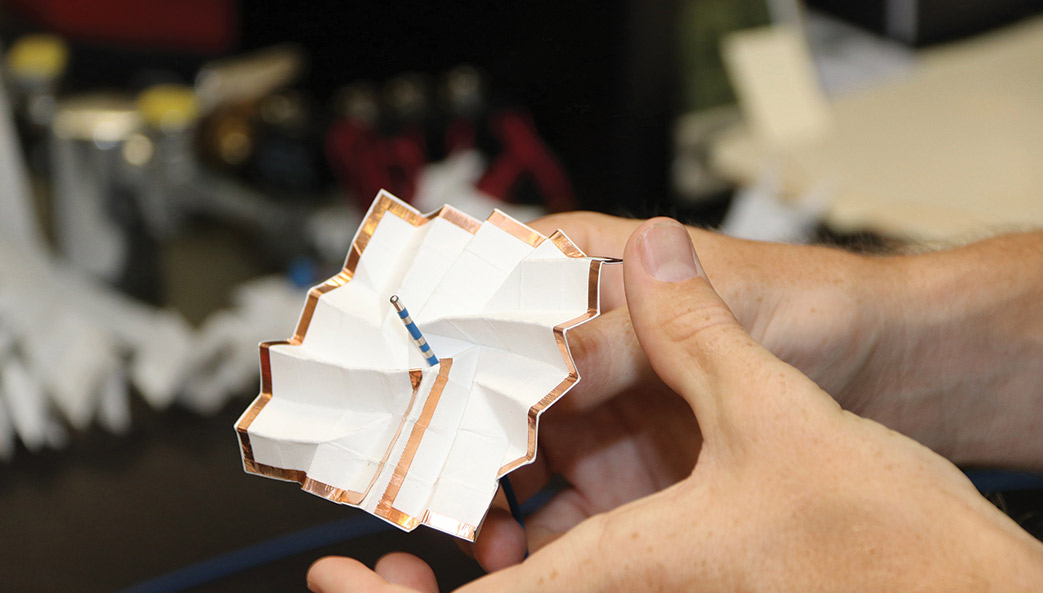 When folded, a prototype of the cardiac catheter resembles an origami pinwheel. It opens into a thin, flat sheet that houses the imaging circuitry.