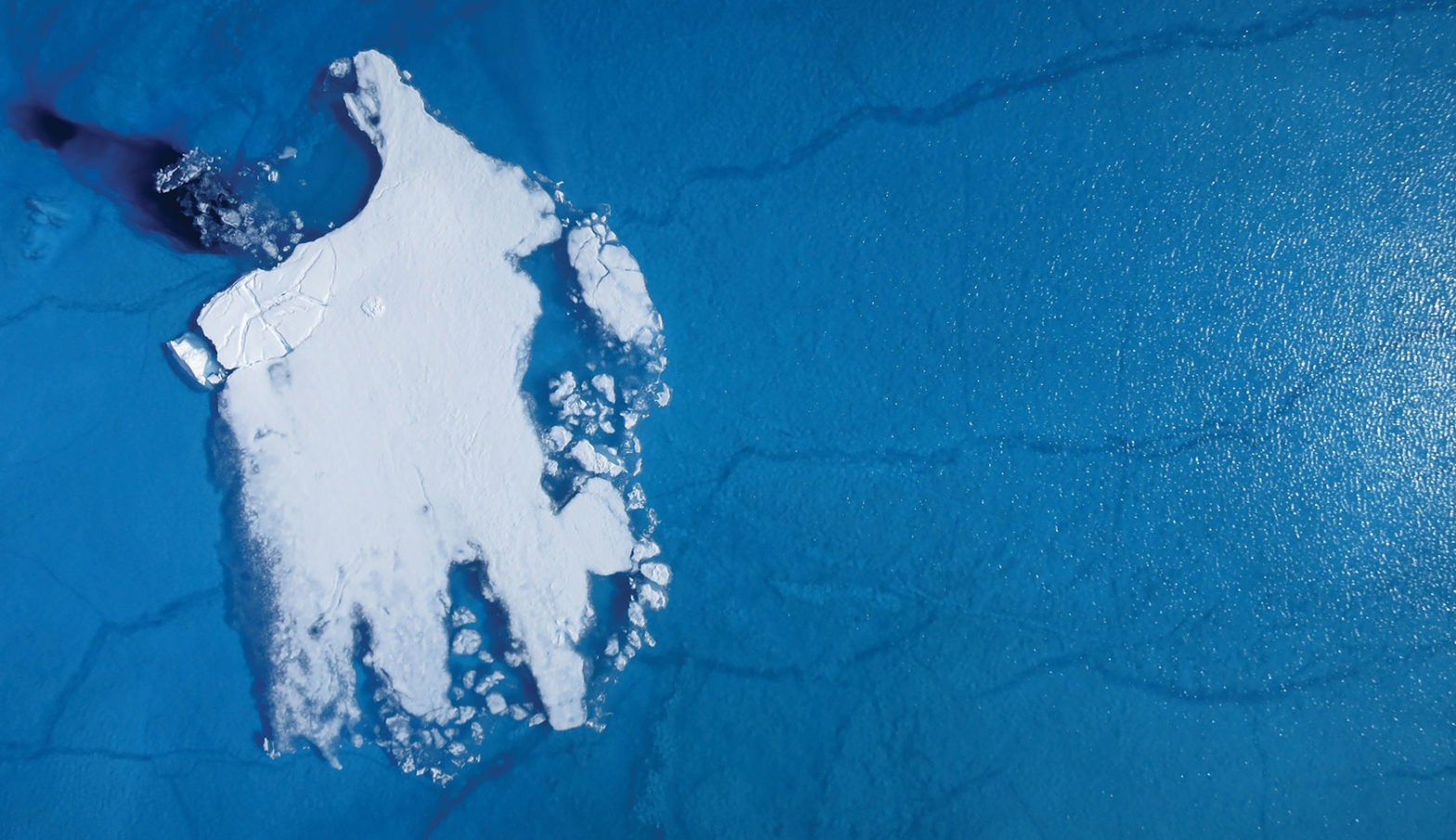 aerial shot of small ice sheet off the coast of Greenland