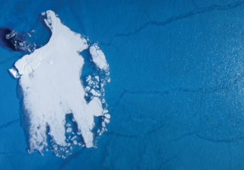 aerial shot of small ice sheet off the coast of Greenland