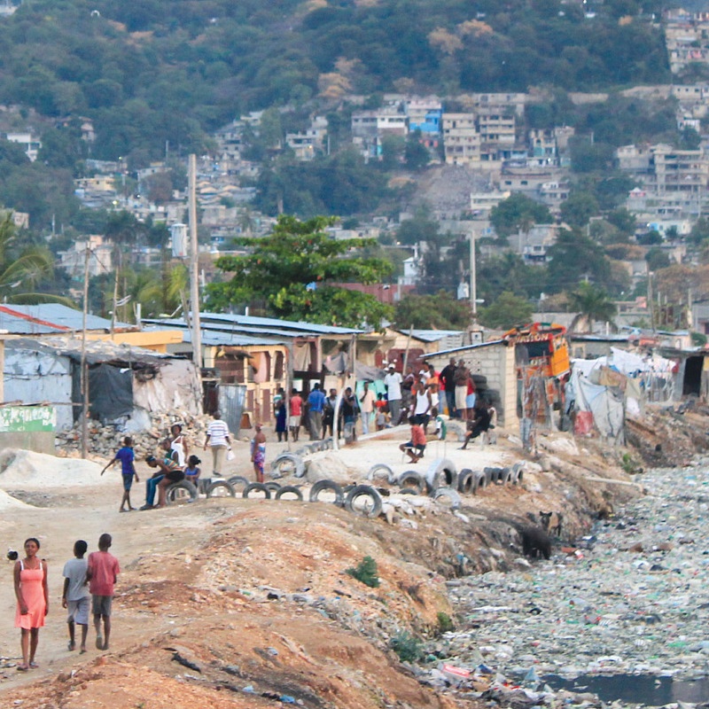 Scene in Haiti with plastic debris in waterway