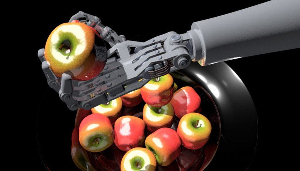 robot arm holding an apple