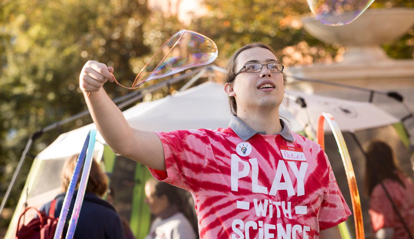 student playing with bubbles