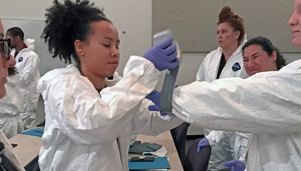 Students participate in outbreak simulation