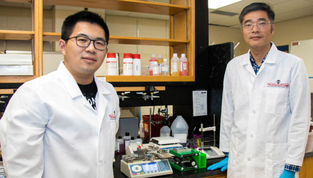 Leidong Mao (right) and graduate student Yang Liu stand in Mao's lab at UGA.