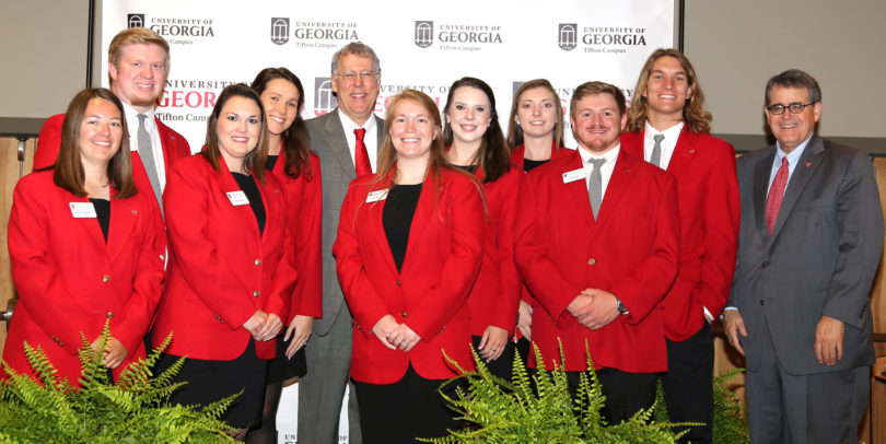 UGA Tifton campus student ambassadors, with CAES Dean Sam Pardue and UGA President Jere W. Morehead, assisted with the centennial celebration.