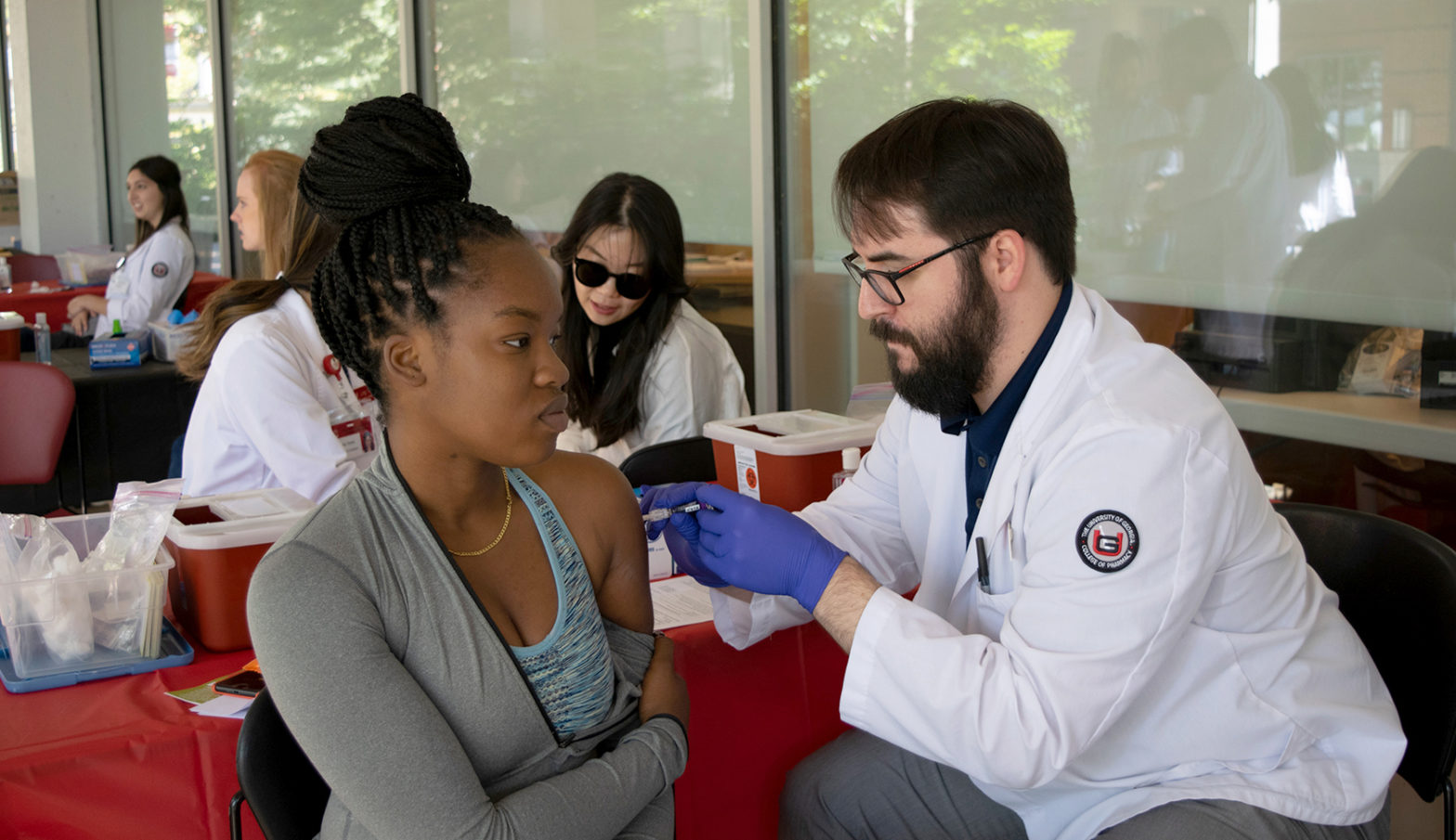 university student receives flu vaccine
