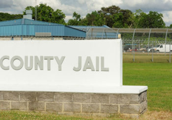 image of a sign in front of a prison