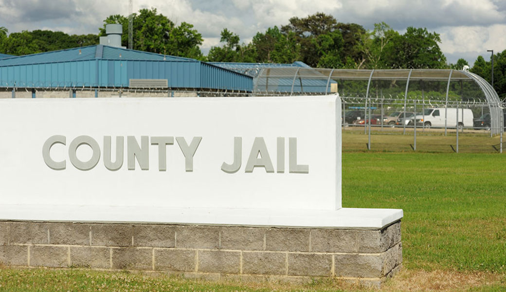 image of a sign in front of a prison