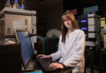 image of student Hannah Stephen sitting at computer in lab