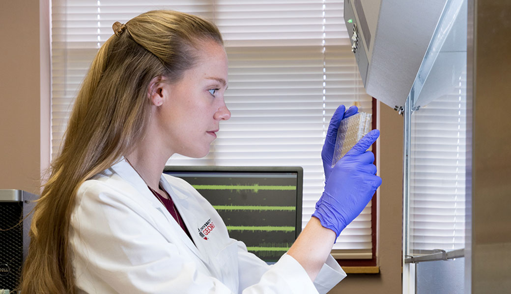 image of grad student Samantha Spellicy in a lab
