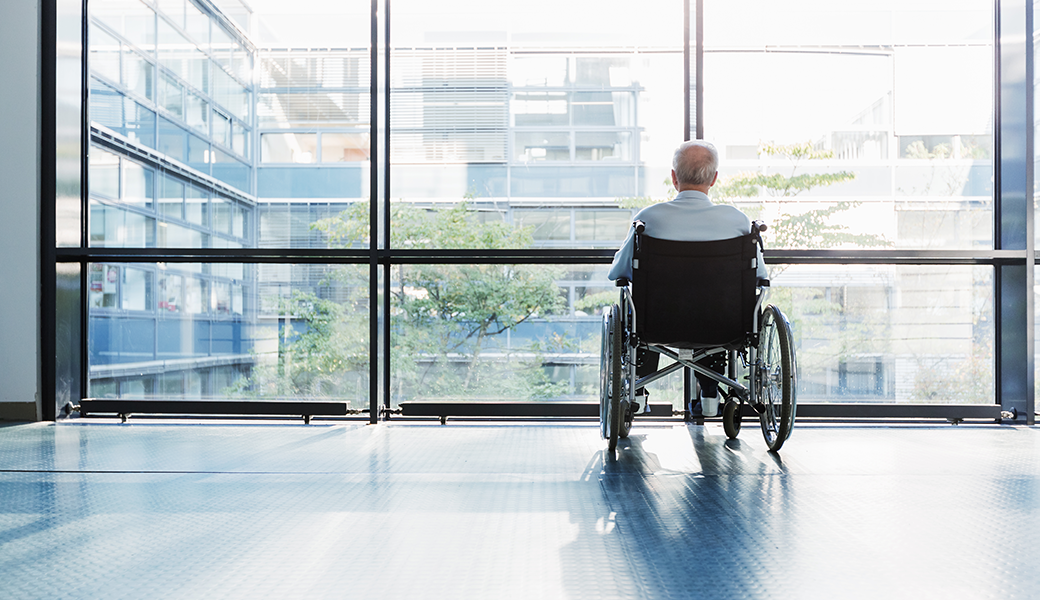 photo of elderly man in wheelchair