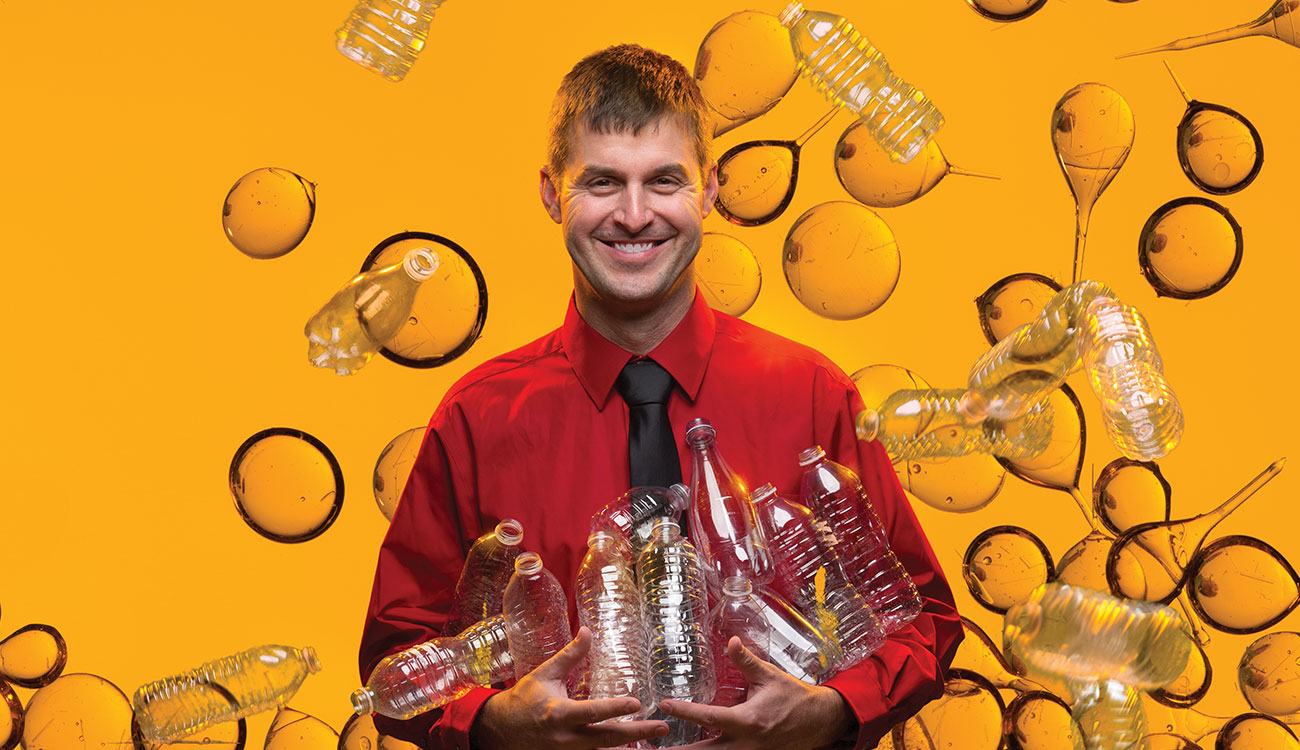 Scientist holding plastic bottles