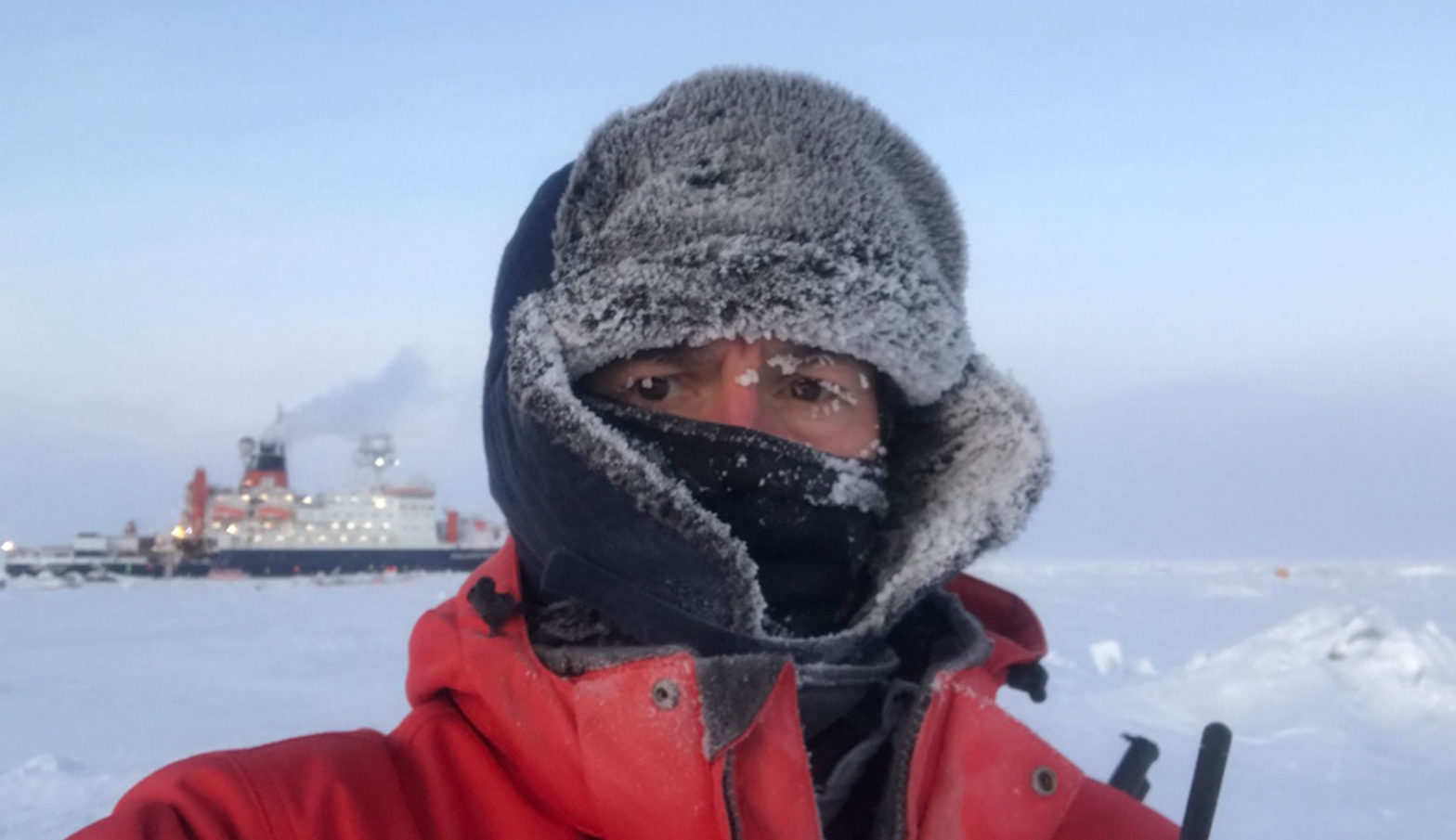 Chris Marsay, UGA scientist at the Skidaway Institute of Oceanography, is two hours into his shift as a bear guard, with the Polarstern vessel in the background.