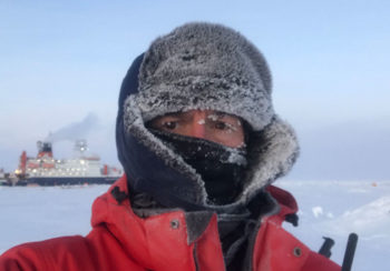 Chris Marsay, UGA scientist at the Skidaway Institute of Oceanography, is two hours into his shift as a bear guard, with the Polarstern vessel in the background.