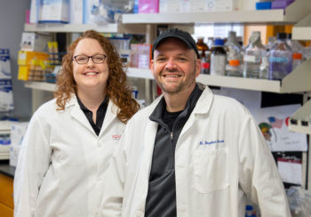 photo of Stephen Trent and colleague in lab