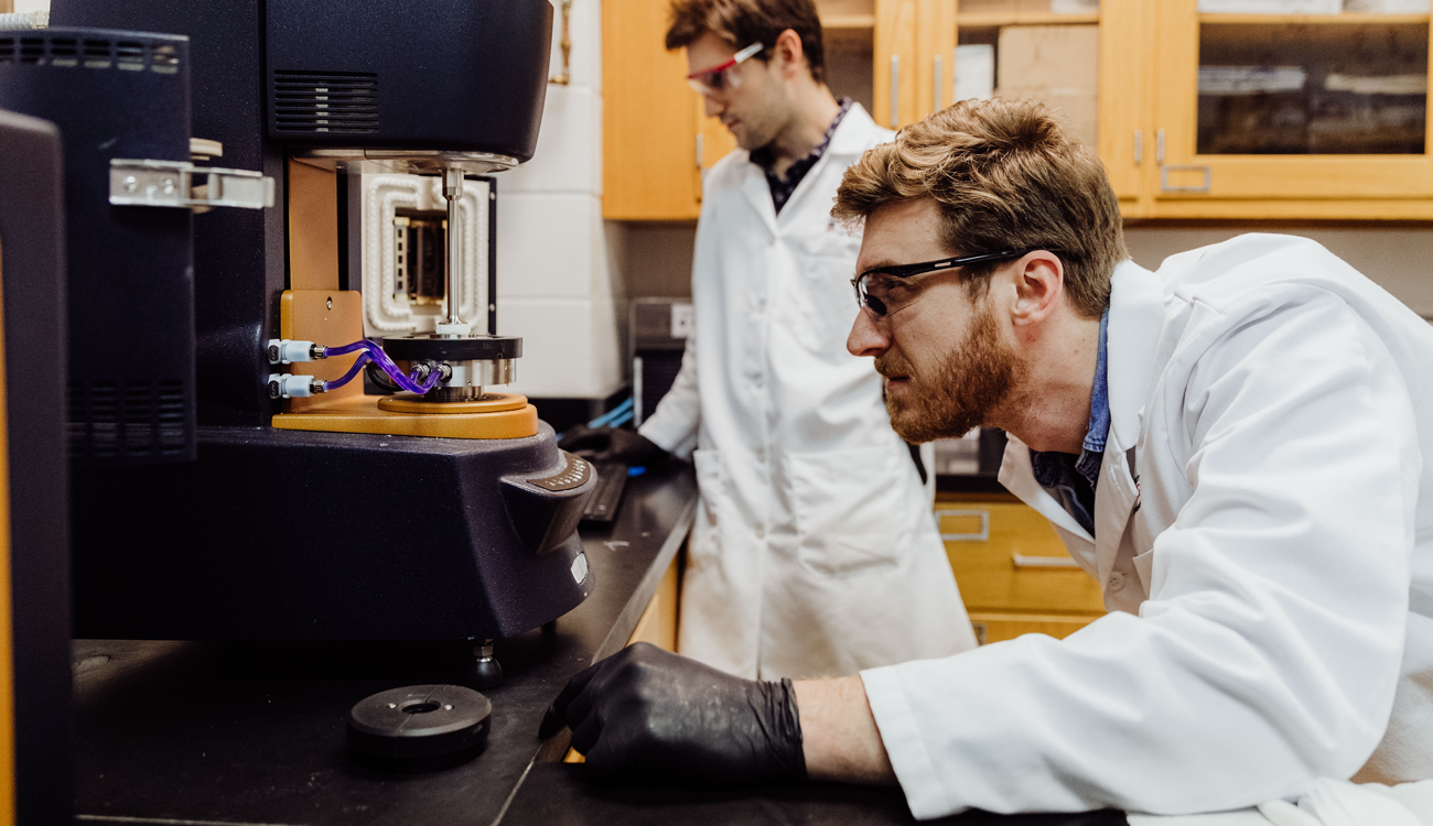 University of Georgia graduate student Tim Henkel in laboratory with researcher Evan White