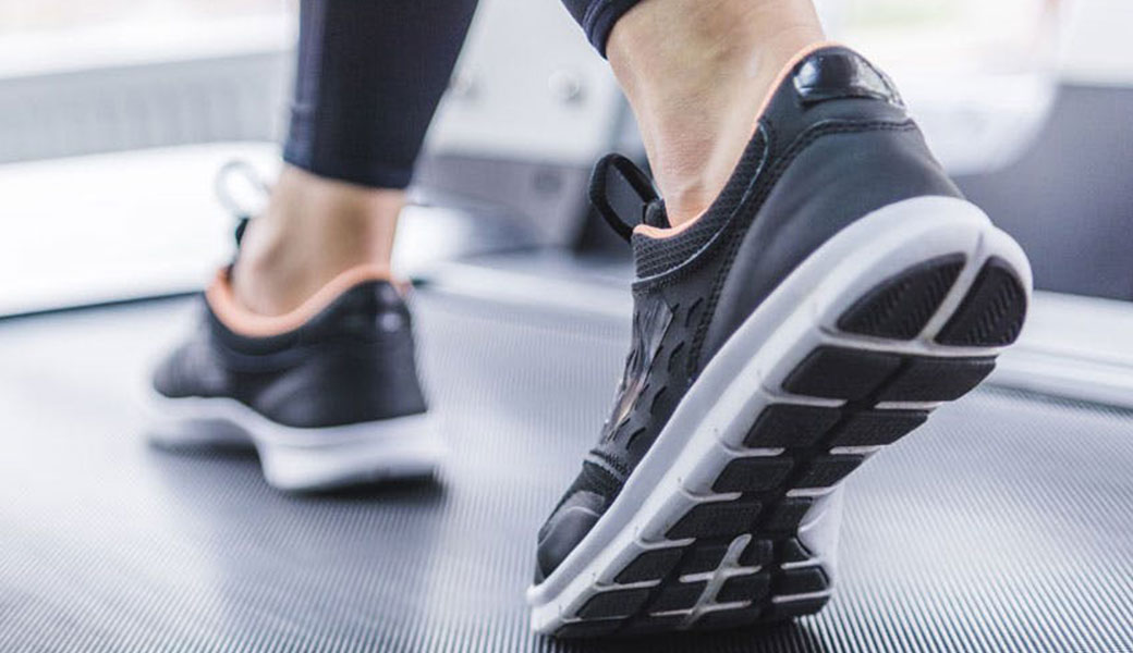 photo of feet walking on treadmill