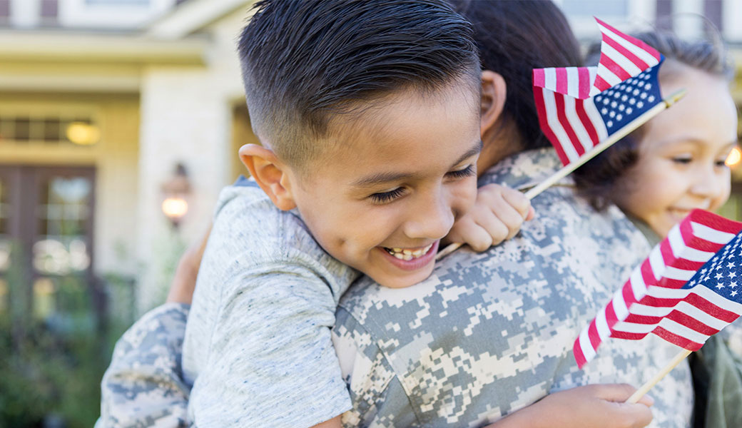 photo of kids hugging their military mom