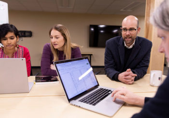 University of Georgia researchers working at table