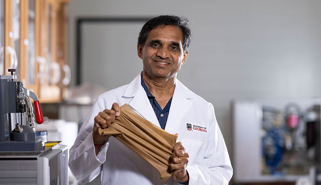photo of Professor Gajanan Bhat holding an elastic nonwoven material