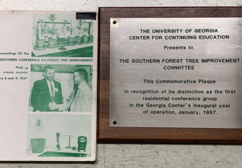 photo of plaque and conference proceedings