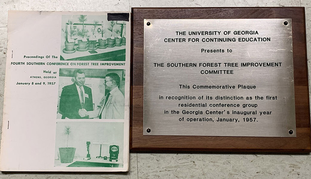 photo of plaque and conference proceedings