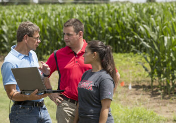 George Vellidis, a professor in the department of crop and soil sciences and University Professor, reviews surface water runoff data with students at the UGA Tifton campus