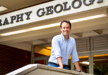 Man standing in front of a geology building
