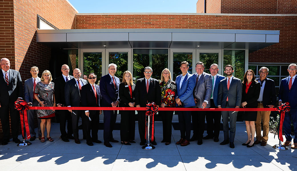 Red ribbon cutting in front of Driftmier Engineering Building