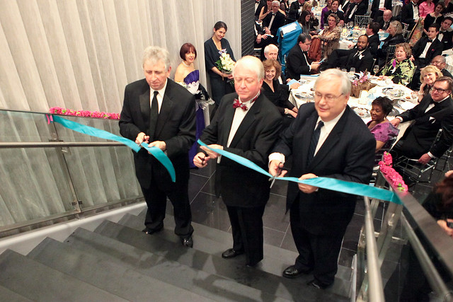 Museum director William U. Eiland, university president Michael Adams and Board of Advisors chair Carl Mullis cut the ribbon at the museum's reopening celebration