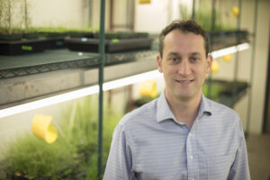 Bob Schmitz smiling at the camera in his plant lab.