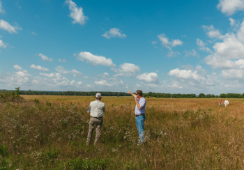 Representatives from UGA and Grand Farm survey the future site of the UGA Grand Farm during a May 2024 visit. The farm will harness the power of precision agriculture, robotics and data analytics to increase productivity, conserve resources and ensure food security for future generations. (Photo by Sean Montgomery)