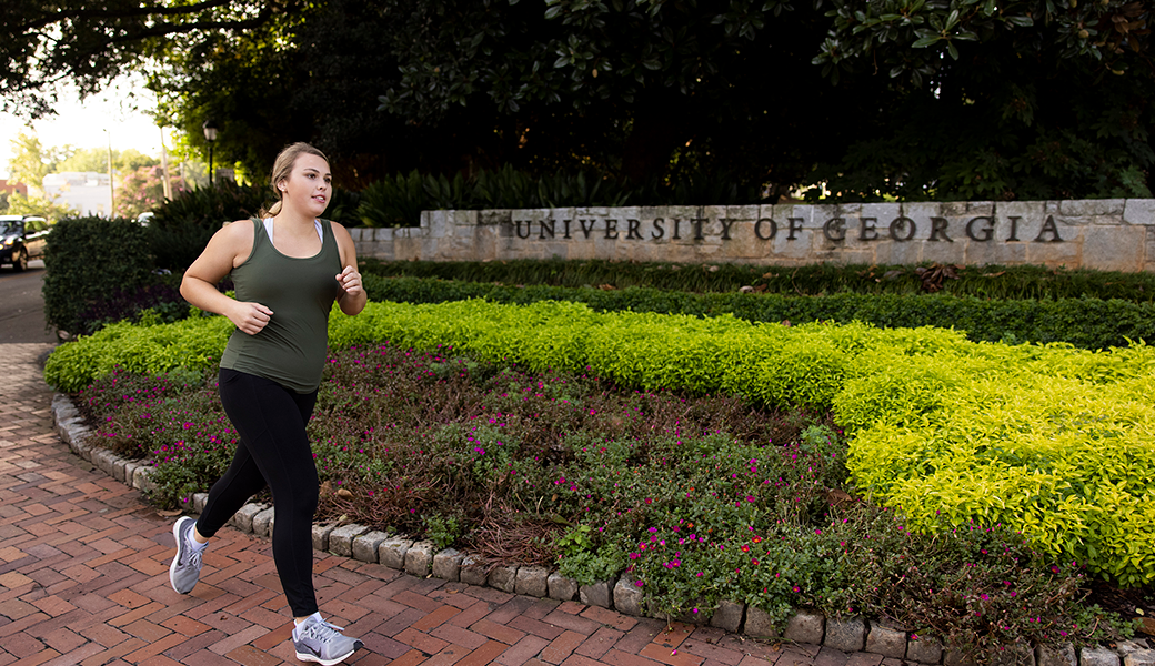 Female jogging down a sidewalk. Samsung and the University of Georgia have developed a personalized Energy Score that will be a primary feature of the new Galaxy Watch. (Andrew Davis Tucker/UGA)