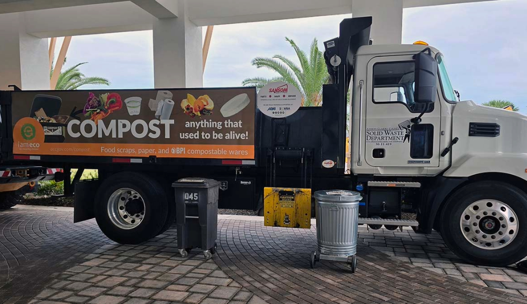 Photo of sanitation and organic scrap collection bins and truck provided by the Athens-Clarke County Solid Waste Department.