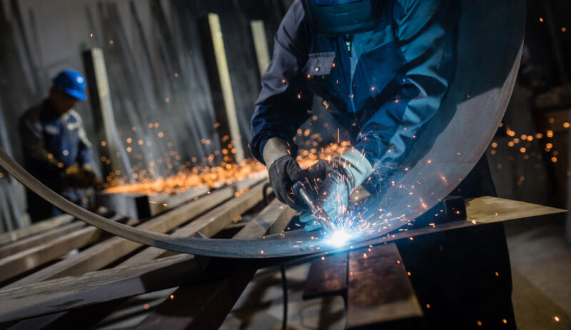 Image of a person welding metal.