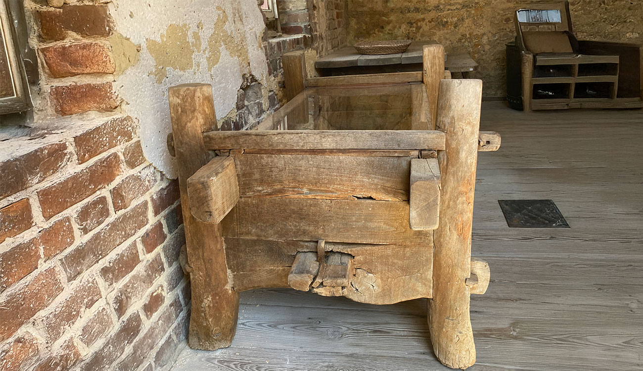 A replica of a wooden feeding trough for cattle on display at the Heyward Washington House.