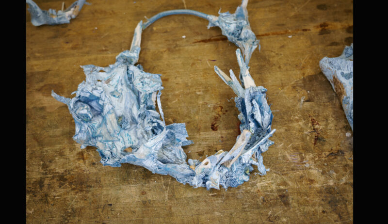 McPherson's jewelry pieces, like this necklace, are intentionally made to be uncomfortable, connecting physical sensation with the emotional and environmental discomfort of plastics in nature. This reflects her belief that art should not just be observed but felt to draw attention to environmental harm and ethical tension.