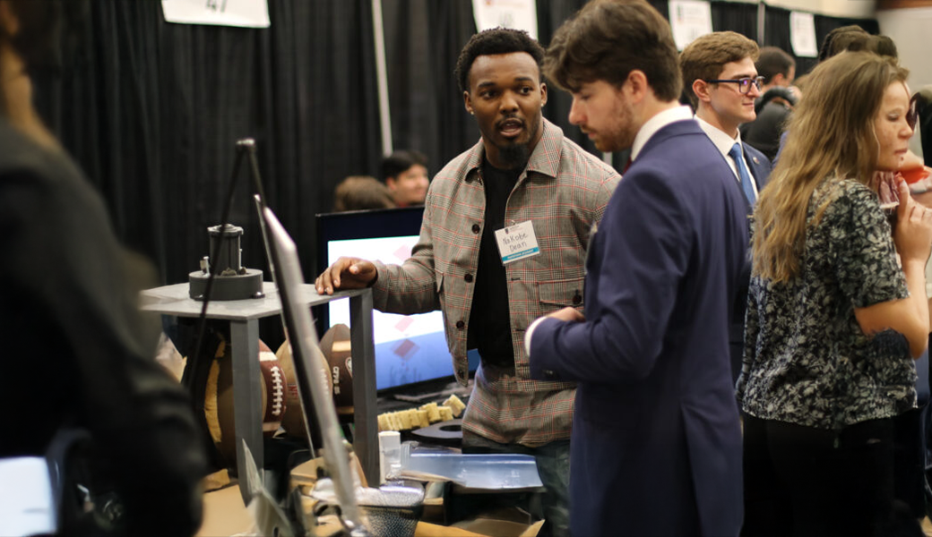 Capstone student Nakobe Dean showcases his project, “Football Mud Remover Device (FMRD).”
