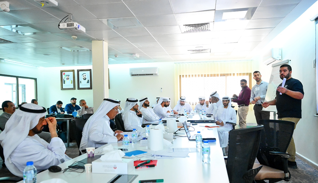 Angelos Deltsidis (center standing), UGA College of Agricultural and Environmental Sciences assistant professor and UGA Extension postharvest specialist, presents to a class in Abu Dhabi, United Arab Emirates. Researchers at CAES and partners across North America are working to help reduce food loss in the UAE, one of the most challenging agricultural environments in the world. (Photo courtesy of the Abu Dhabi Agriculture and Food Safety Authority)