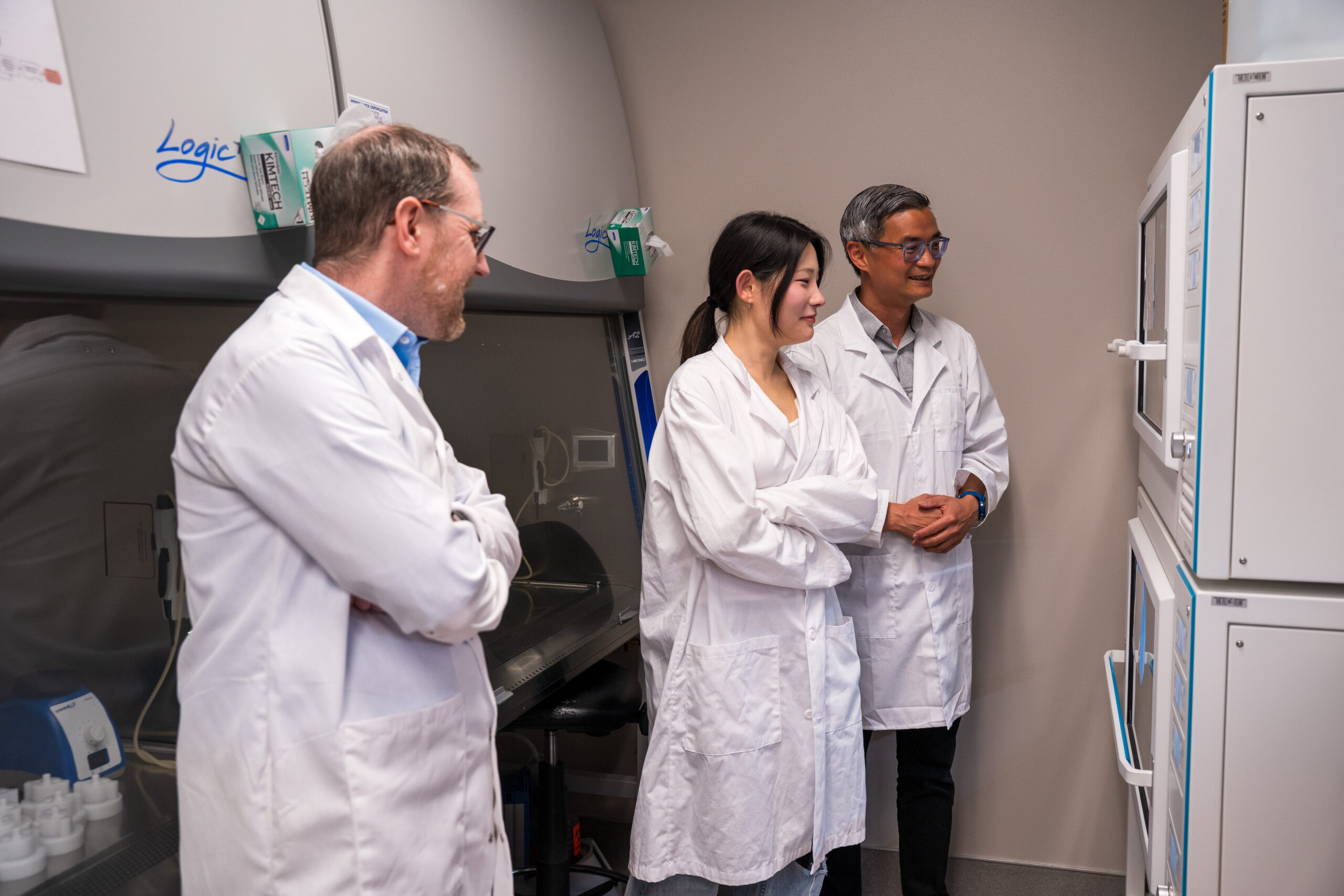 Nathan-Lewis-3 Left to right, Nathan Lewis, Ph.D. student Haining Li and associate research scientist Chenlin Hsieh observe a piece of equipment in Lewis’ lab in the Center for Molecular Medicine. Lewis recruited Hsieh after moving to UGA, however several members of the research team followed Lewis to Athens from the University of California San Diego in 2024.