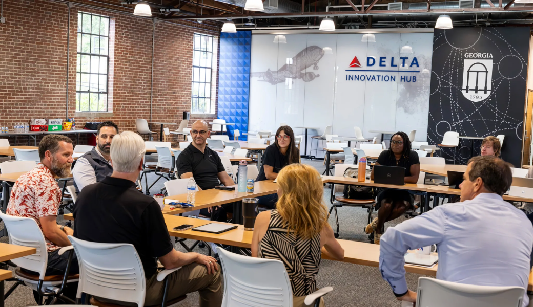 Fellows interact during the Faculty Innovation Fellows Roundup at the Innovation Hub.