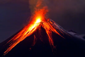 Tungurahua Volcano eruption at night, with snow, Ecuador