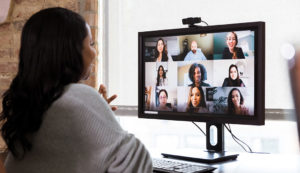 woman participating in online meeting