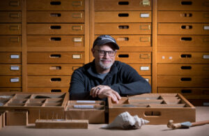 A man looks at artifacts