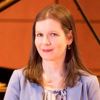 Liza Stepanova in front of piano